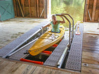 Launch system built into a boathouse slip