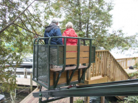 Hillside trolley serves as an alternative to stairs on a steep site on Lake George NY