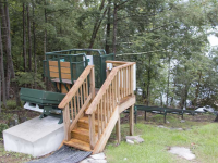 Hillside trolley serves as an alternative to stairs on a steep site on Lake George NY