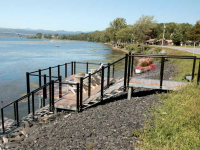 Steel stairs and shoreside platform for a roadside waterfront site